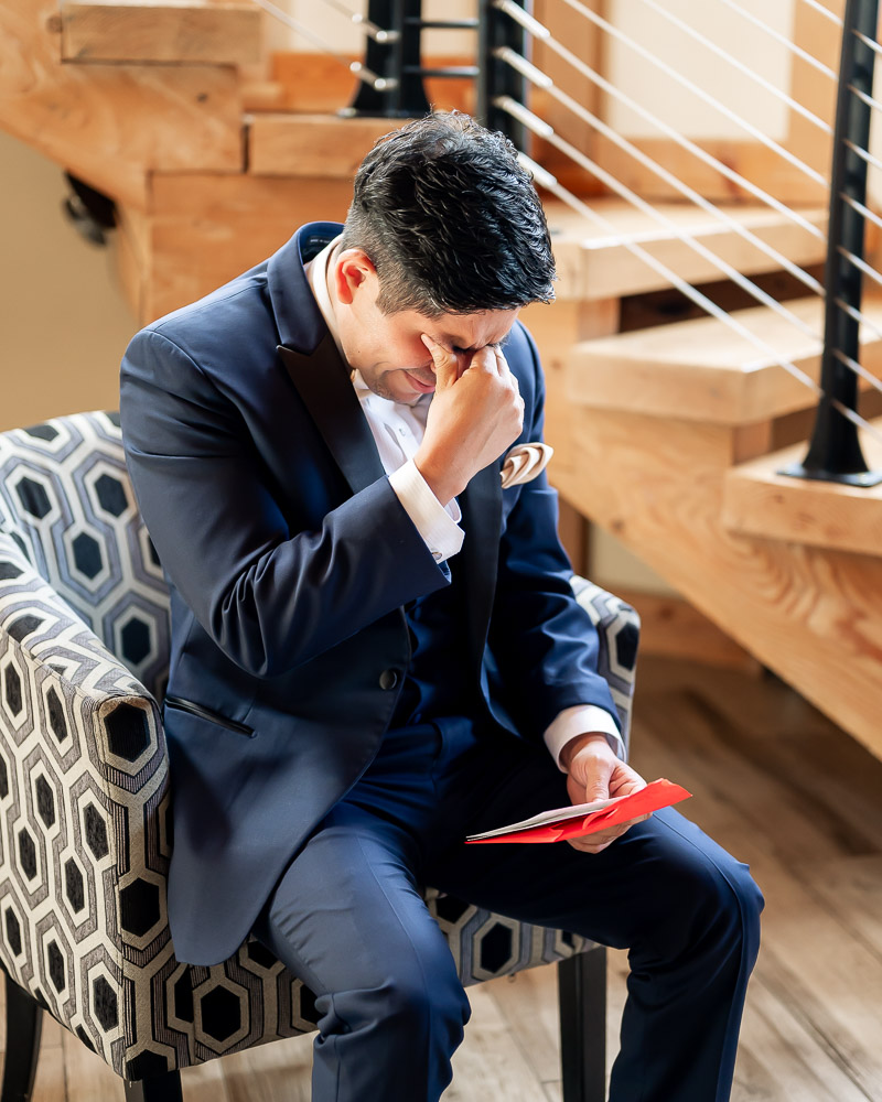 groom crying after reading letter from bride at rock island lake club