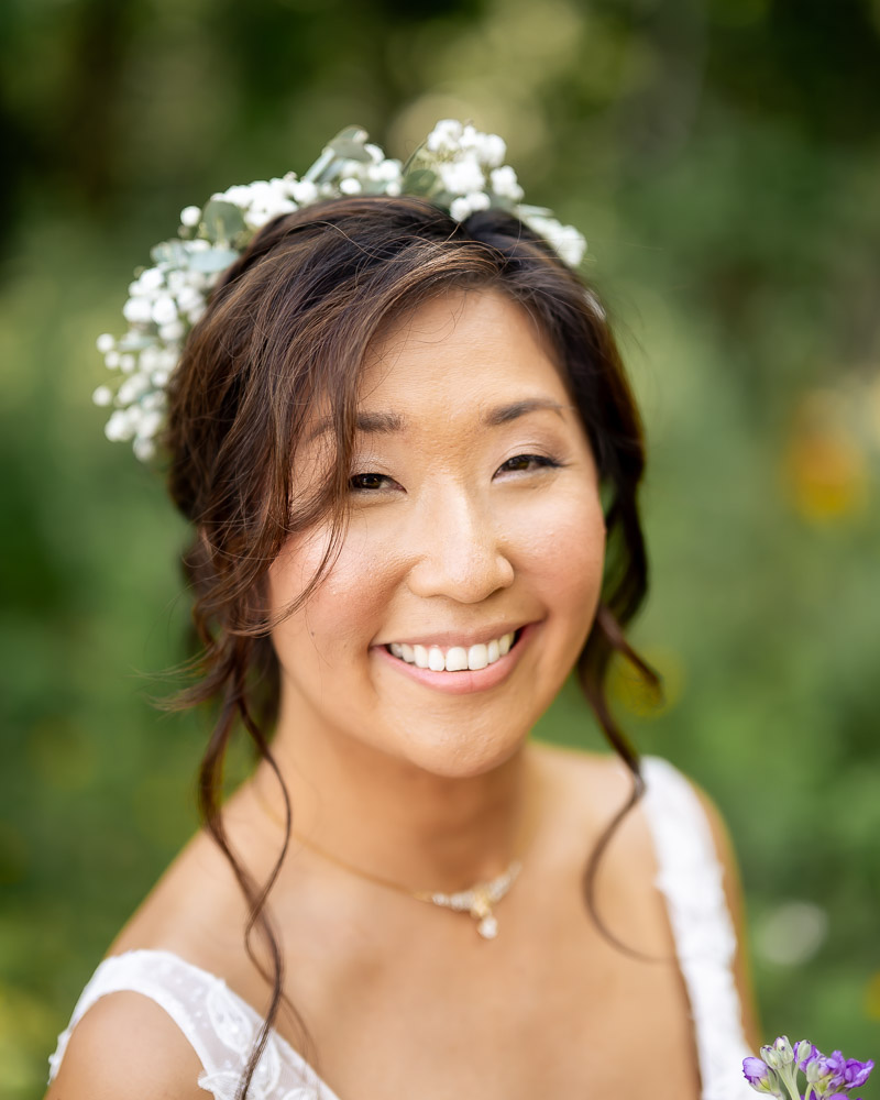 bride having her portraits taken in the whimsical fields at rock lsland lake club