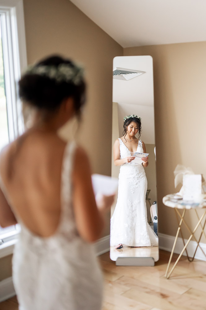 bride reading letter from groom at rock island lake club