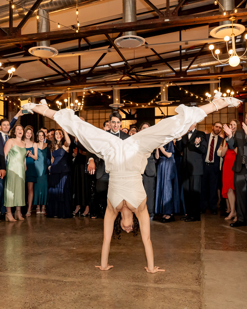 Bride does a handstand during first dance at Lilah Events in Fishtown Philadelphia